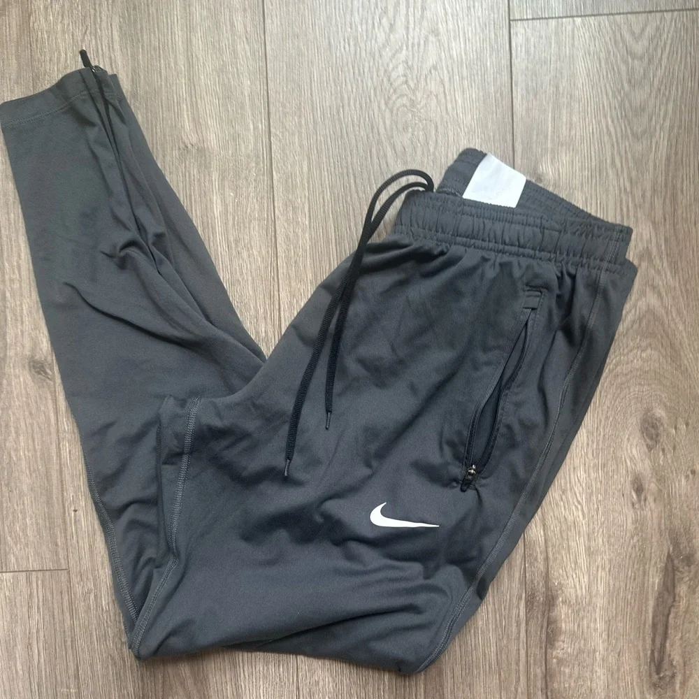 Nike Dri Fit Women's Charcoal Track Joggers with White Swoosh